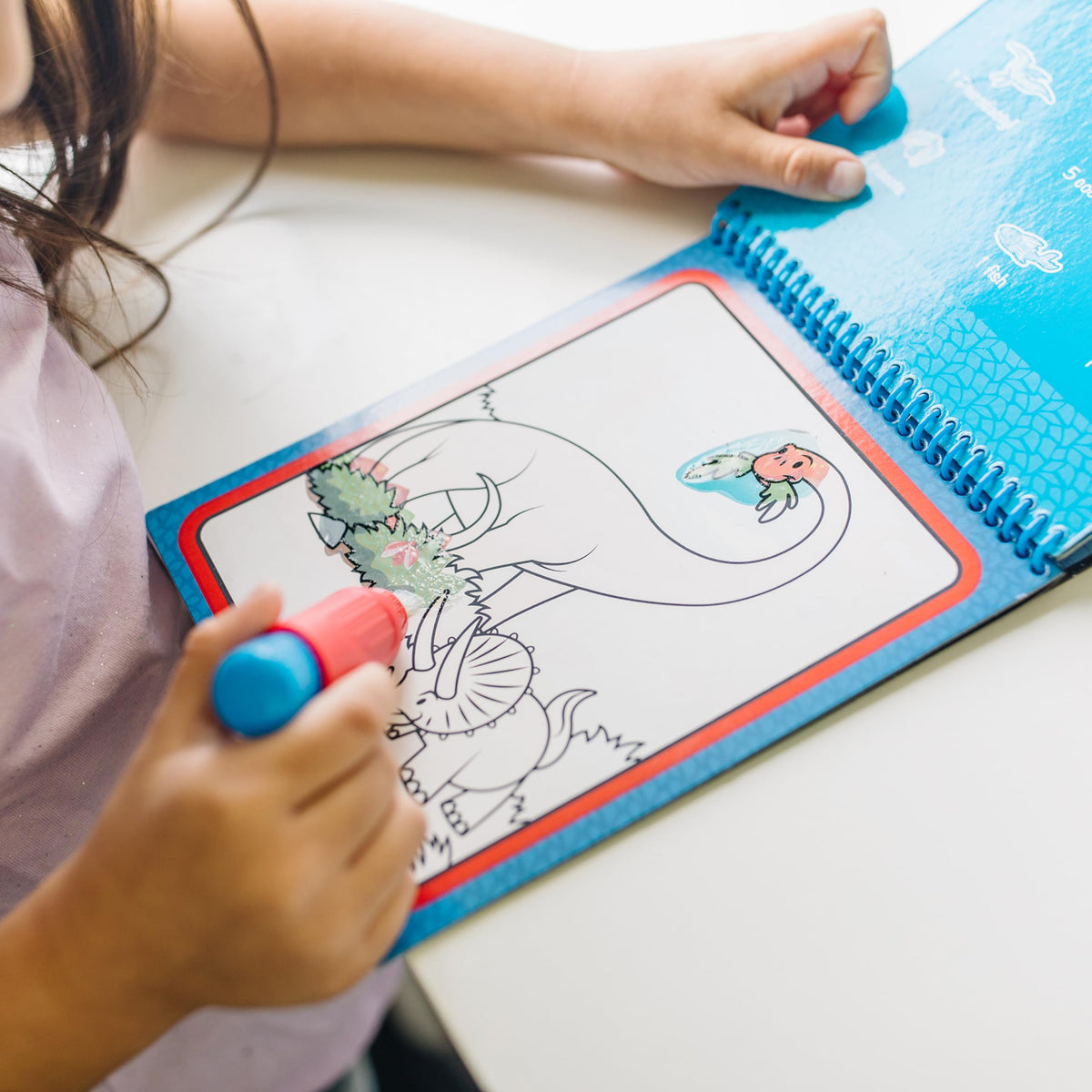 Melissa & Doug Water Wow pen stored in pad for easy travel and use.