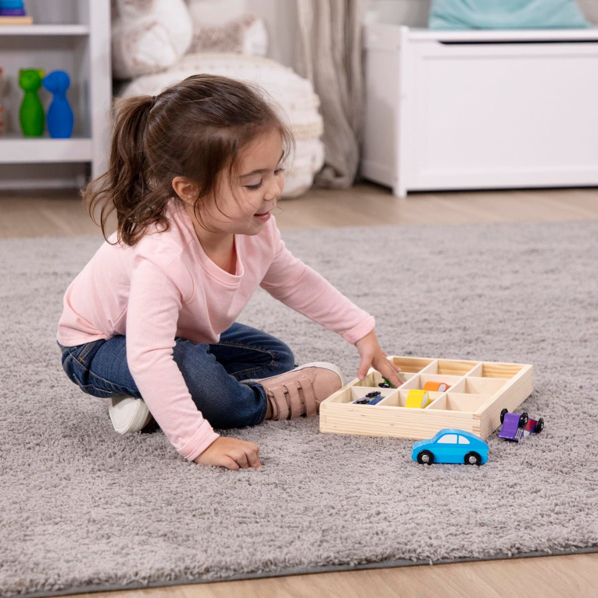 Melissa & Doug cars in vivid colors promote visual recognition during play.