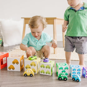 Wooden cars from Melissa & Doug roll smoothly for fine-motor play.