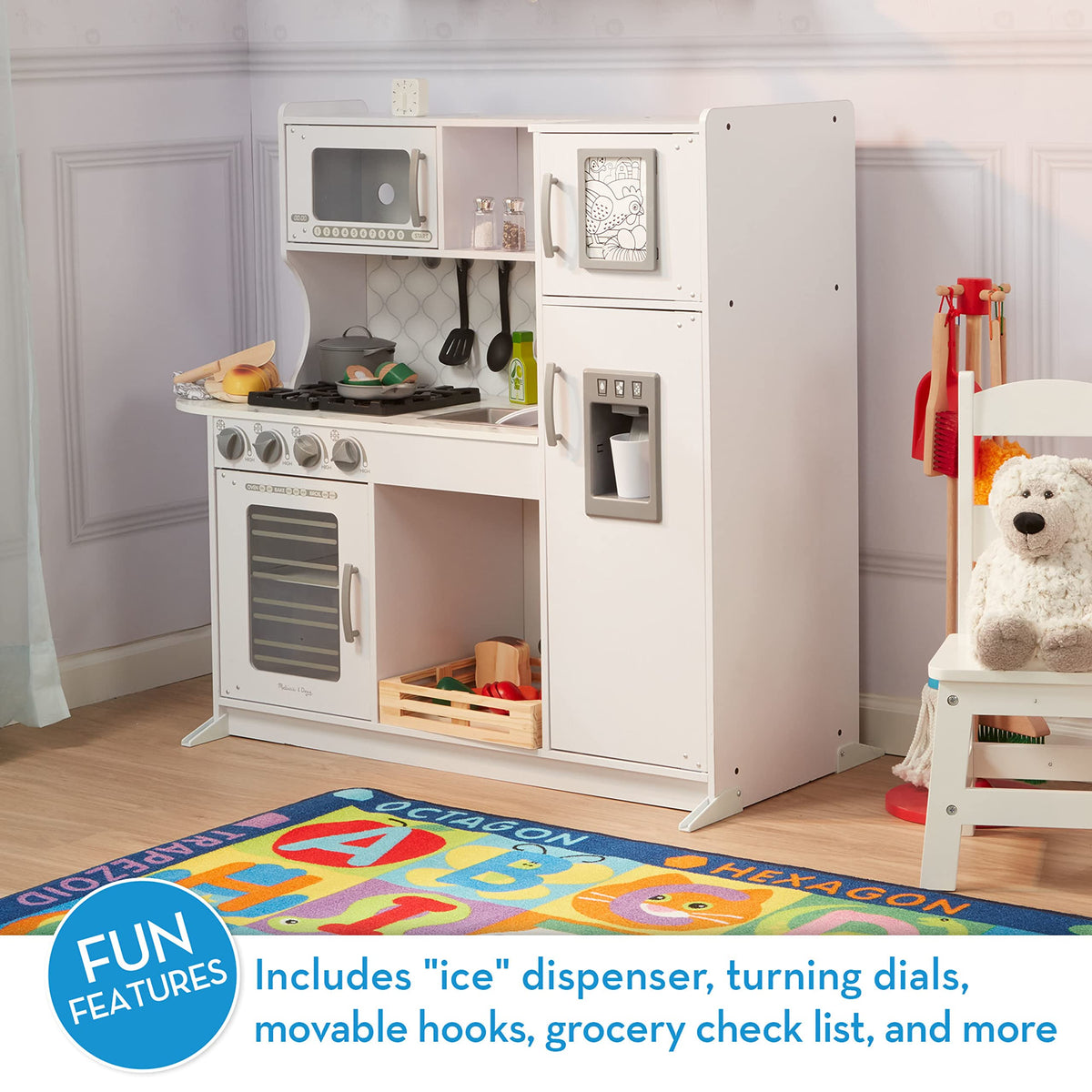 Melissa & Doug wooden chef’s kitchen refrigerator and freezer with pretend ice maker.