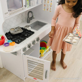 Melissa & Doug wooden chef’s kitchen storage shelves and hooks for organized play.