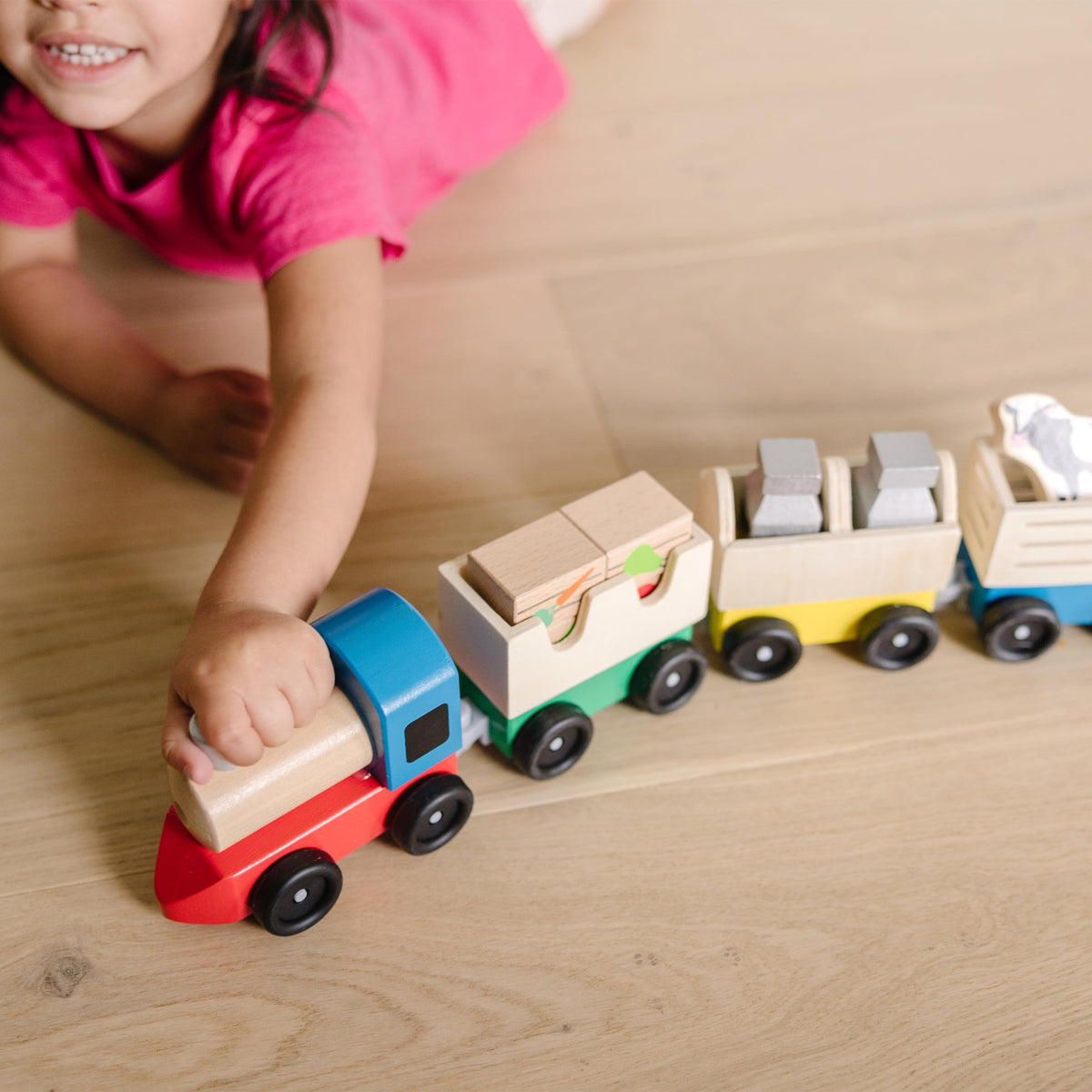 Melissa & Doug wooden farm train fruit crates—colorful blocks for sorting and counting.