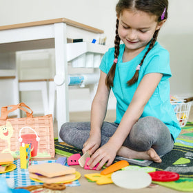 Colorful wooden ice pops and juice boxes add tactile play options.