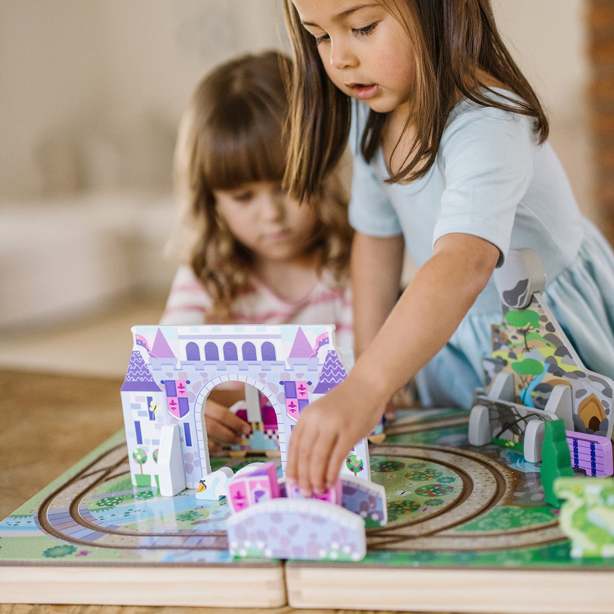 Melissa & Doug wooden kingdom horse partnered with carriage to spark guided play.