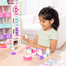 Melissa & Doug wooden lipsticks and eye shadows close-up for pretend makeup exploration
