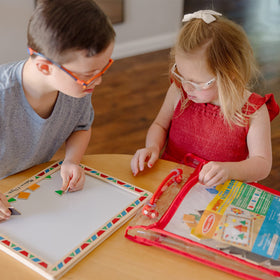Melissa & Doug wooden magnetic play board provides sturdy storage.