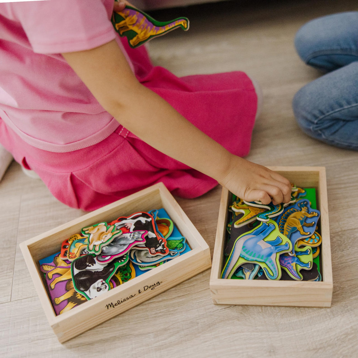 Melissa & Doug wooden magnets include 20 animal magnets for diverse storytelling.