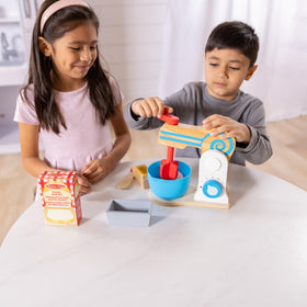 Melissa and Doug wooden make-a-cake mixer set bowl included encourages hands-on play.