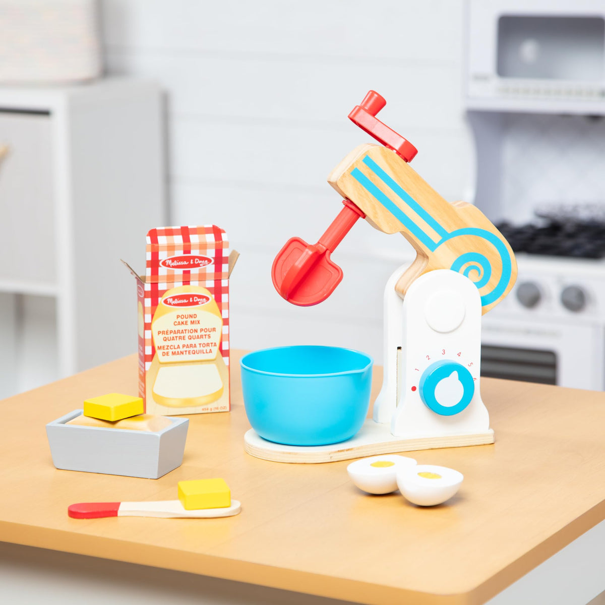 Melissa and Doug wooden make-a-cake mixer set wooden knife for safe pretend cutting.