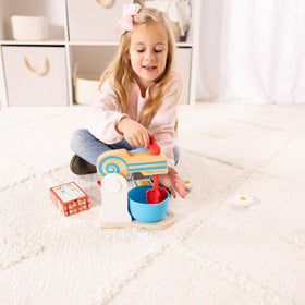 Melissa and Doug wooden make-a-cake mixer set egg piece invites pretend slicing.