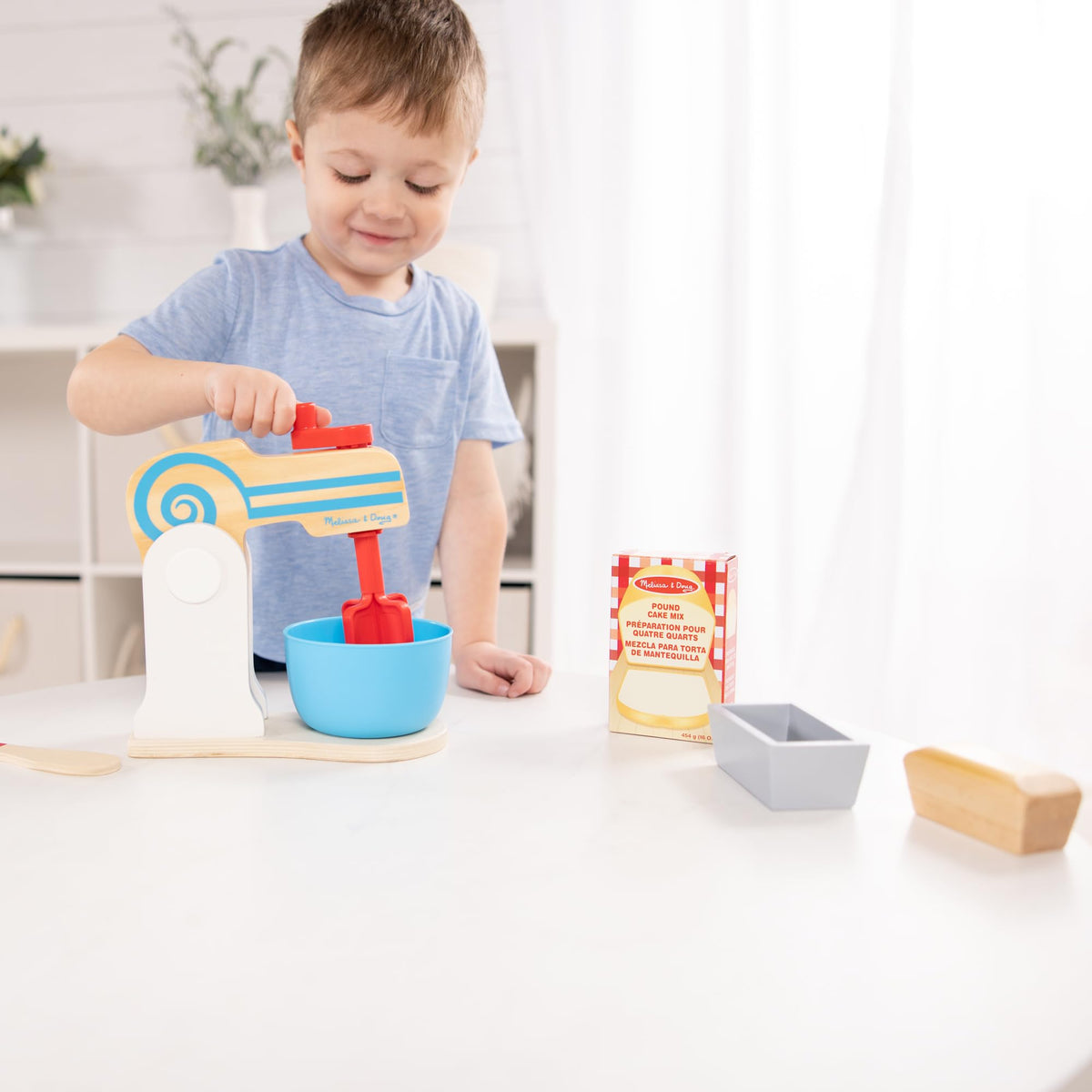 Melissa and Doug wooden make-a-cake mixer set loaf pan and cake pan for baking stories.