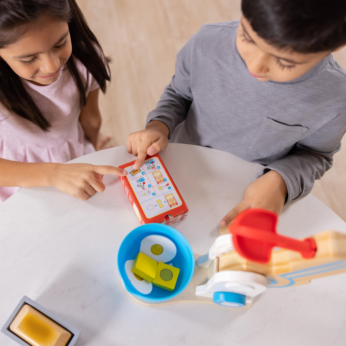 Melissa and Doug wooden make-a-cake mixer set ages 3+ supports early learning.