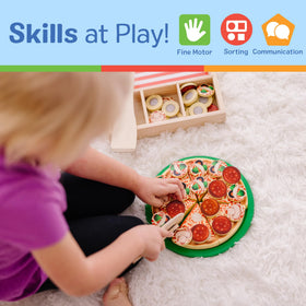 Melissa & Doug pizza spatula assists guiding toppings and serving with pretend cheer
