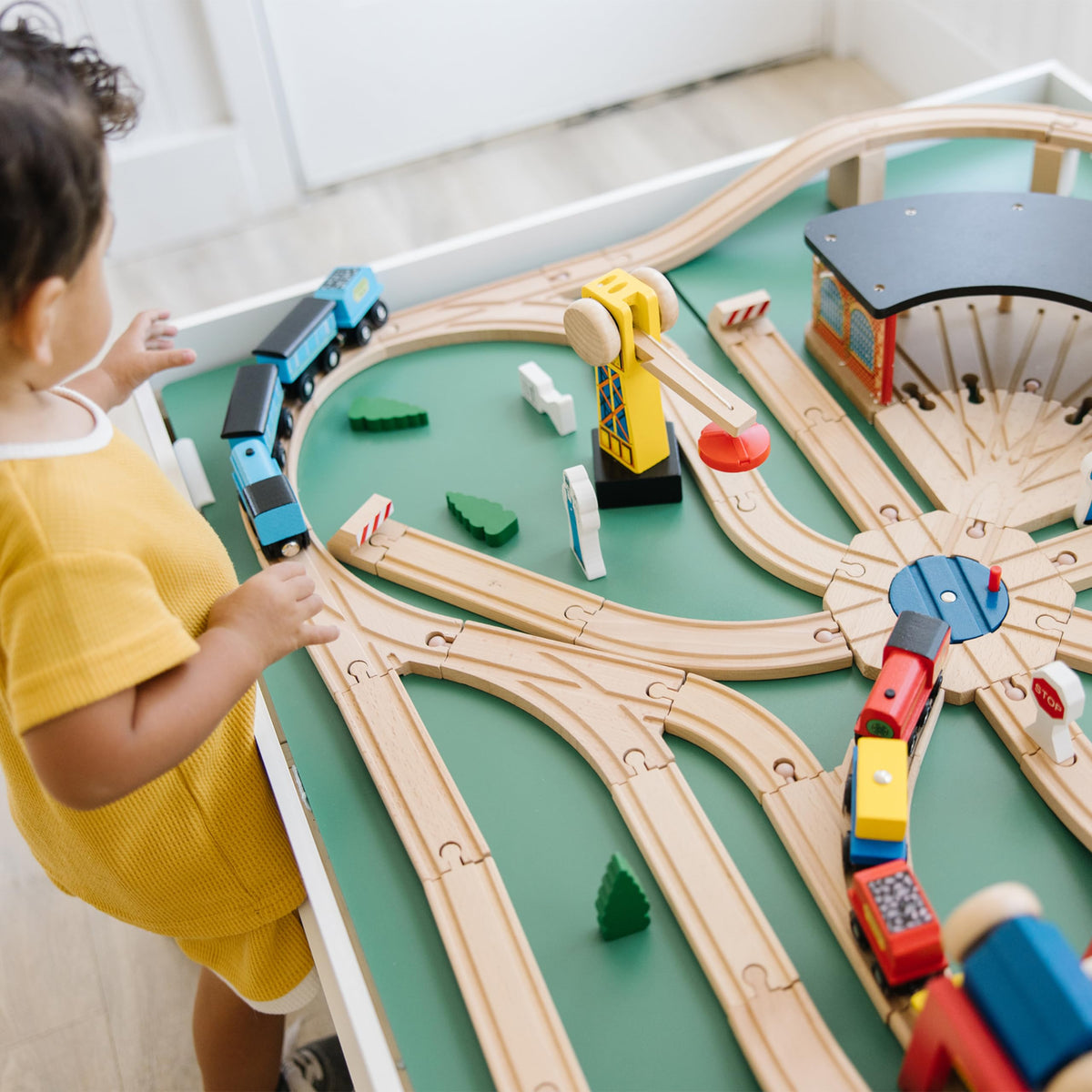 Melissa & Doug Wooden Railway Curved Track enables fluid layouts for trains.