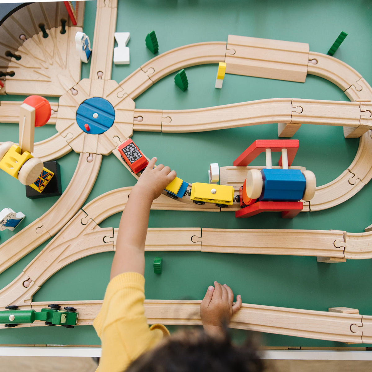 Melissa & Doug Wooden Railway Straight Track provides sturdy paths for routes.