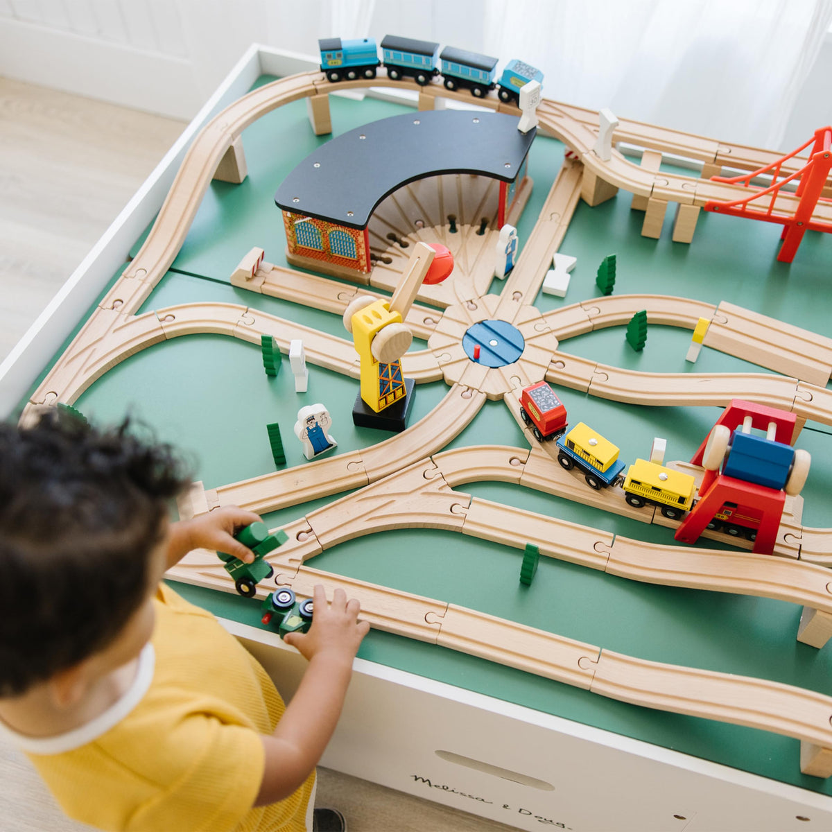 Melissa & Doug T-Junction Switch supports multiple route configurations.