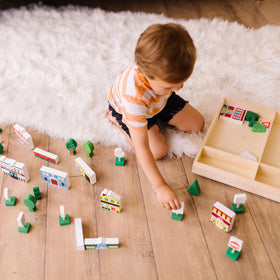 Melissa & Doug wooden town benches and fountain create cozy outdoor scenes.