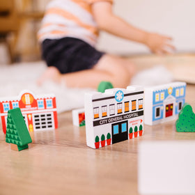 Melissa & Doug wooden town brick wall highlights boundary ideas during playtime.