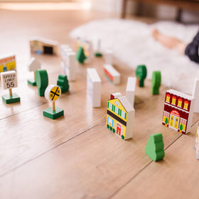 Melissa & Doug wooden town service station adds practical fueling scenes.
