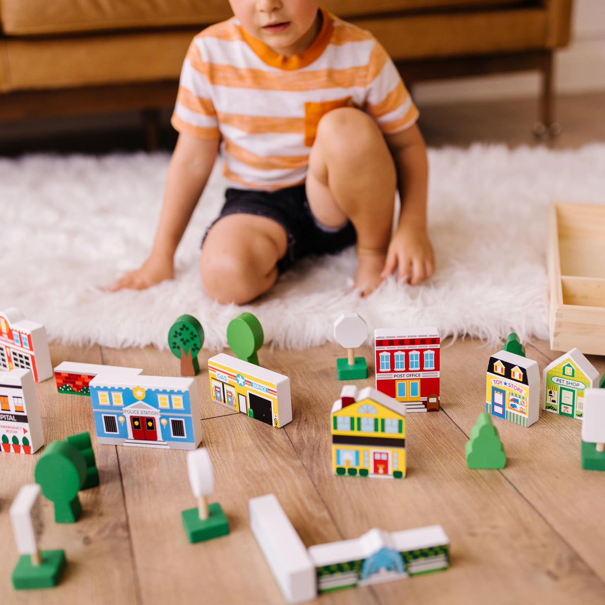 Melissa & Doug wooden town traffic signs guide organized play and role-play scenarios.