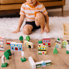 Melissa & Doug wooden town traffic signs guide organized play and role-play scenarios.