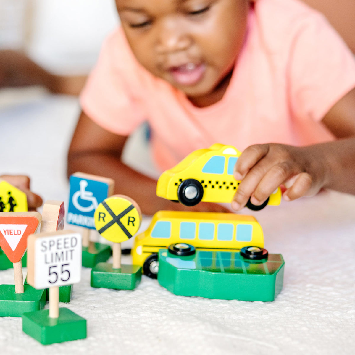 Melissa & Doug wooden yield sign helps teach traffic awareness through play.