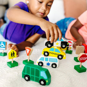 Melissa & Doug wooden school bus encourages storytelling and color recognition.