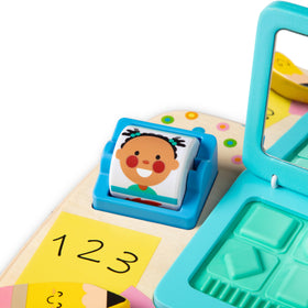 Melissa & Doug beads tumble inside as you spin the rolling contact list for tactile play.