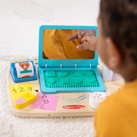 Melissa & Doug board with rubberized keyboard buttons to touch and press for shape recognition.