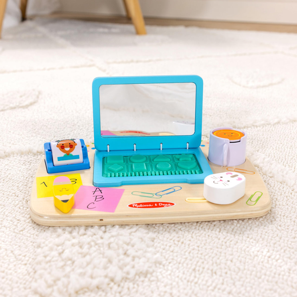 Melissa & Doug board features adorable characters and textures to spark exploratory play.