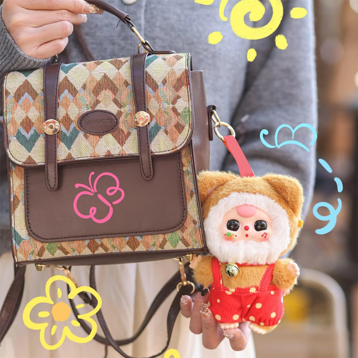 Meokro plush pendant attached to a bag for a cute accessory