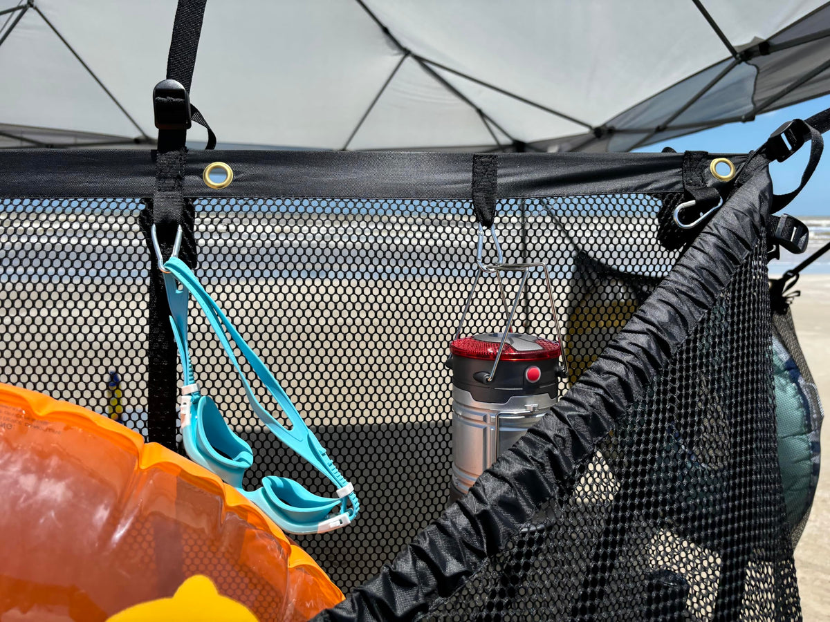 MESH TITAN Canopy-tent mounting between trees for flexible setup.