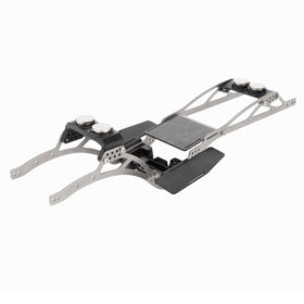 MEUS RACING SCX24 LCG titanium chassis with shock-mount holes for adjustable tuning.