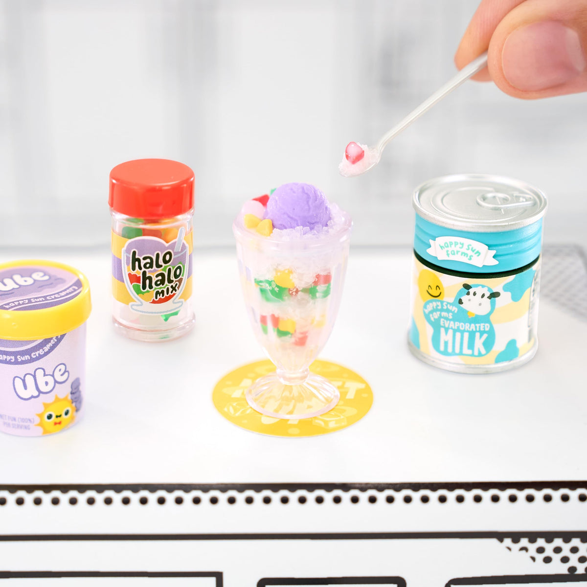 MGA's Miniverse Make It Mini Cafe Series 4 display capsules highlight collected mini foods