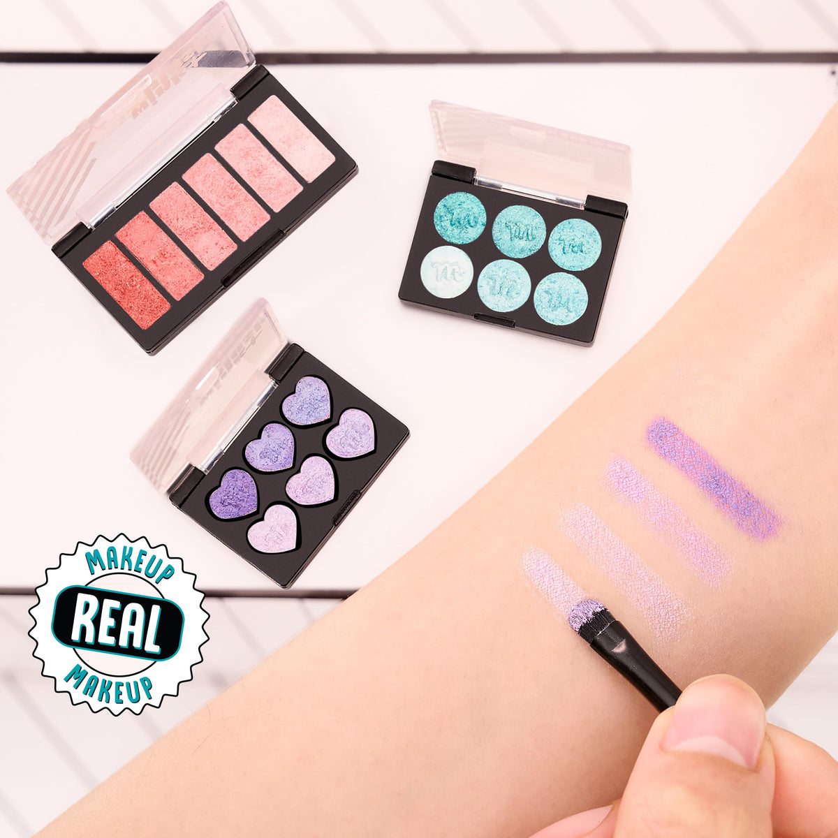 MGA's Miniverse Make It Mini Makeup Ball eyeshadow set with compact color options.