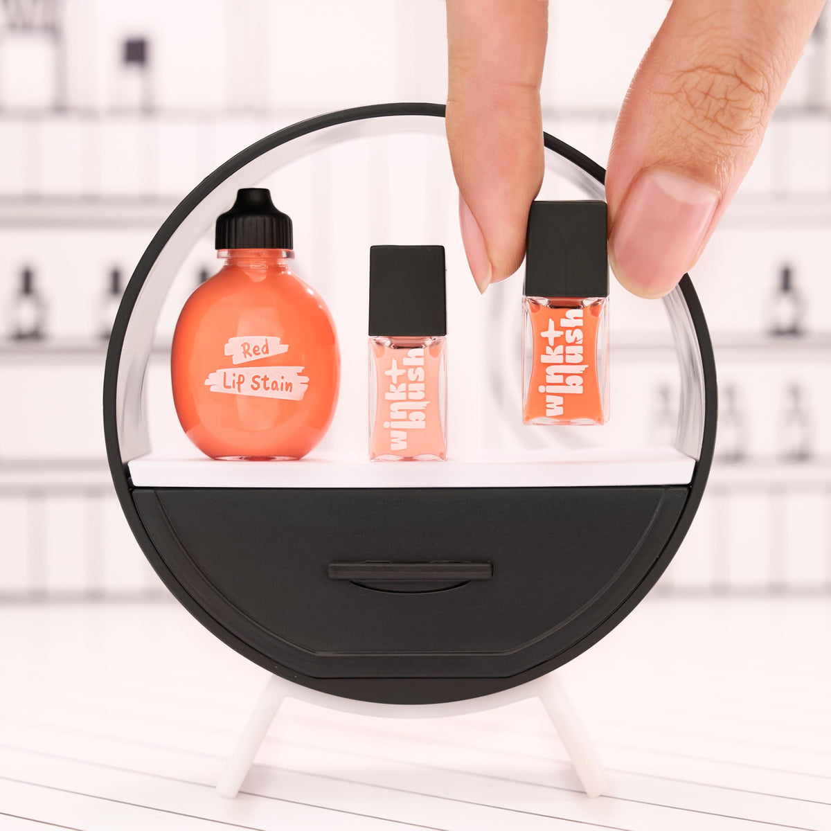 MGA's Miniverse Make It Mini Makeup Ball nail polish mini tubes for quick color checks.