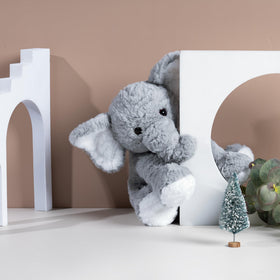 Mikee Fluffie elephant plush being hugged by child for comfort