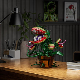 Millionspring Audrey II vines and body structure assembled with bricks for dramatic decor.