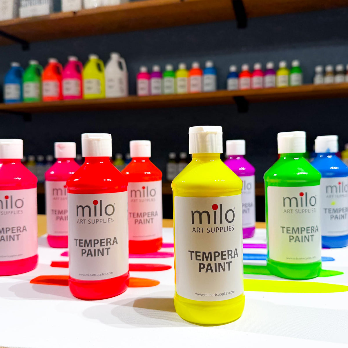 Milo fluorescent orange bottle sparks bold art under ultraviolet light