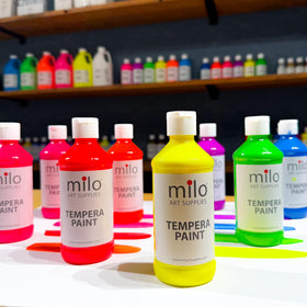 Milo fluorescent orange bottle sparks bold art under ultraviolet light
