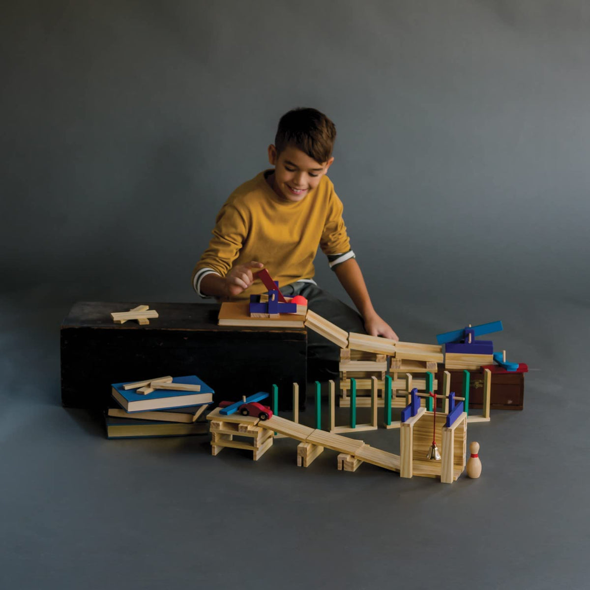 MindWare KEVA Contraptions ball-run display showing marble-driven paths and cause-and-effect play.