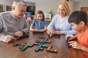 MindWare Qwirkle set on table with colors and shapes for strategic line-building.