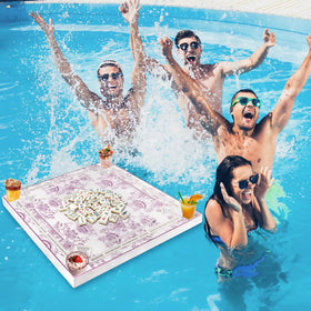 Poolside game table ready for cards and Scrabble near water.