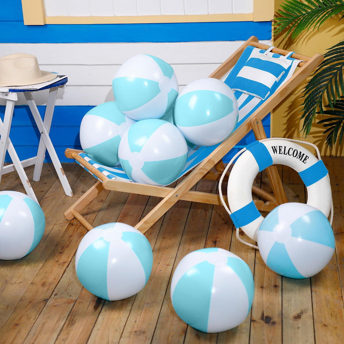 MiniInflat pastel blue ball shows white stitching for visibility on sand.