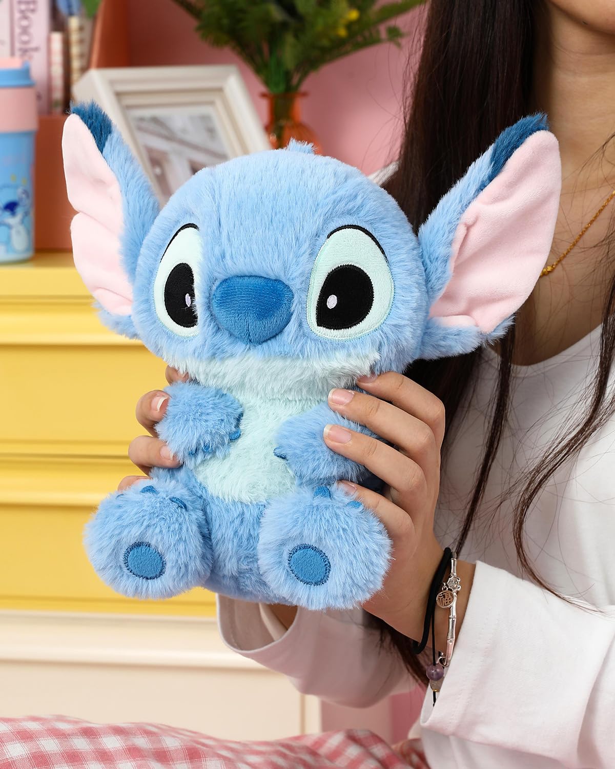 MINISO Stitch plush on desk, bedside, or car for cozy decor.