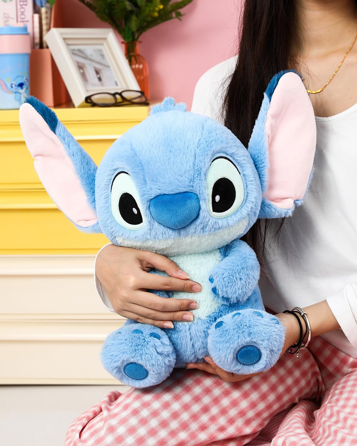 MINISO Stitch plush close-up highlights bright eyes and soft touch.