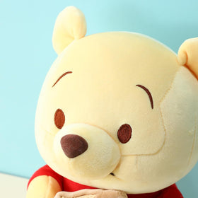 MINISO Winnie-the-Pooh plush as a gentle bedtime companion.