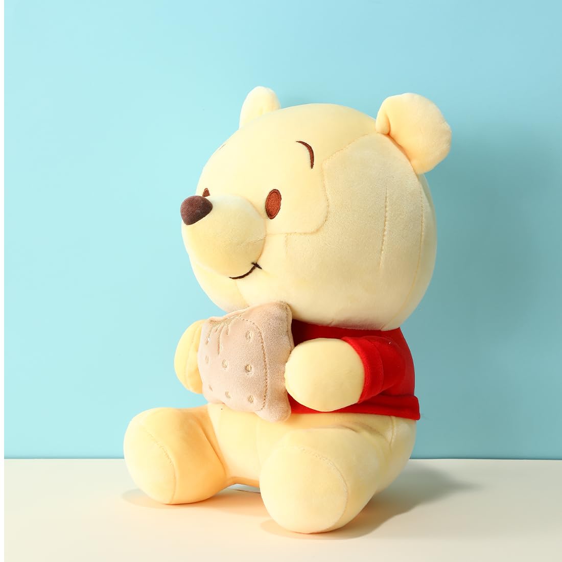 MINISO Winnie-the-Pooh plush close-up reveals soft fur and careful stitching.
