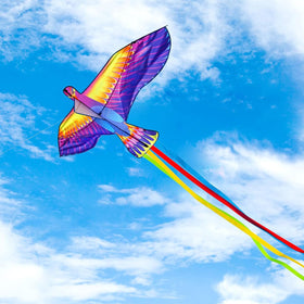 Mint's Colorful Life blue dragon kite gliding high on a windy day