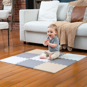 MioTetto baby play mat tiles arranged for a safe, soft crawl area